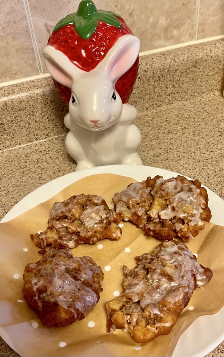 Glazed apple fritters on a plate