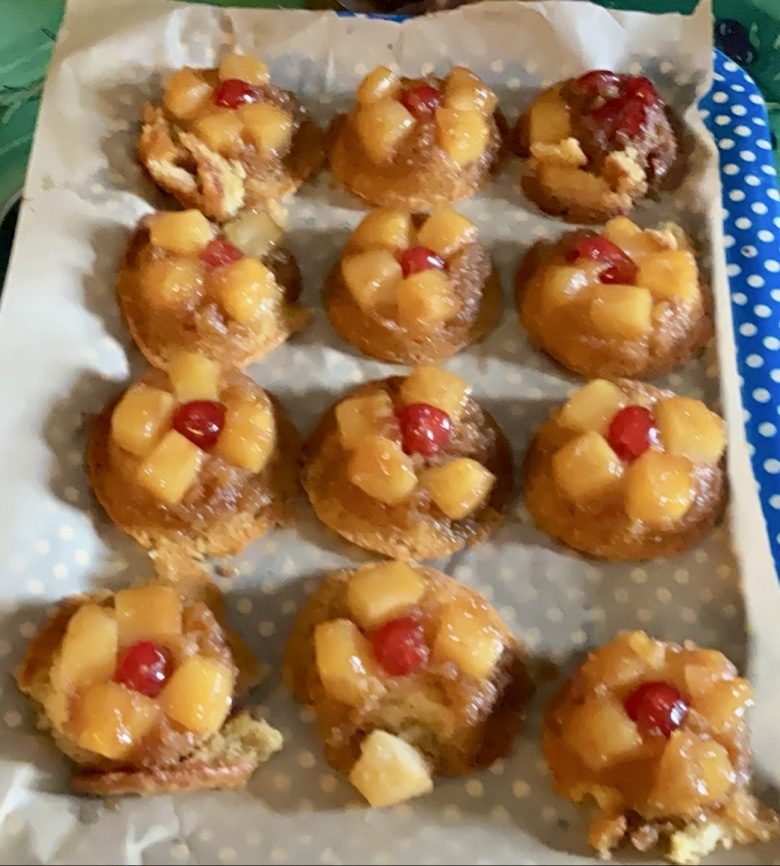 Mini pineapple upside-down cakes topped with cherries