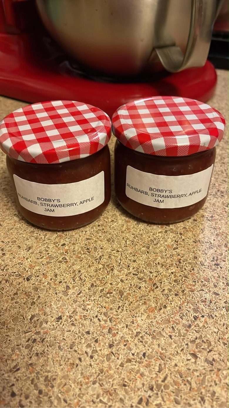 Two jars of homemade strawberry-rhubarb-apple jam